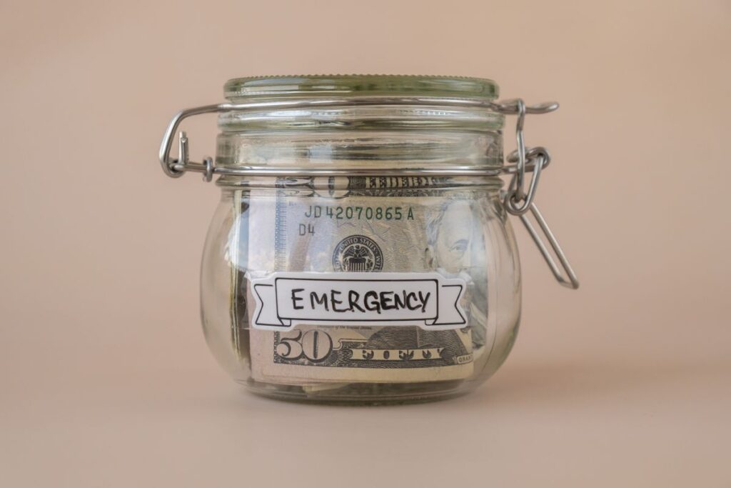 Saving Money In Glass Jar filled with Dollars banknotes